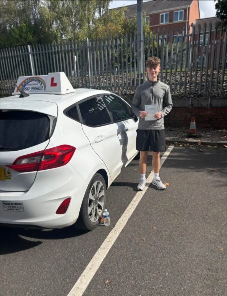 Pupil beside the Rainbows learner car