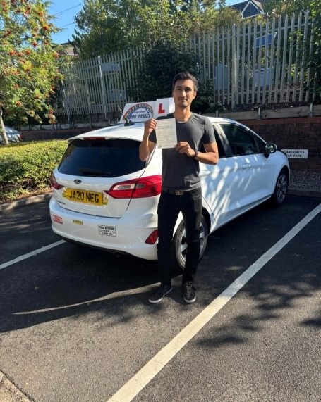Pupil beside the learner car